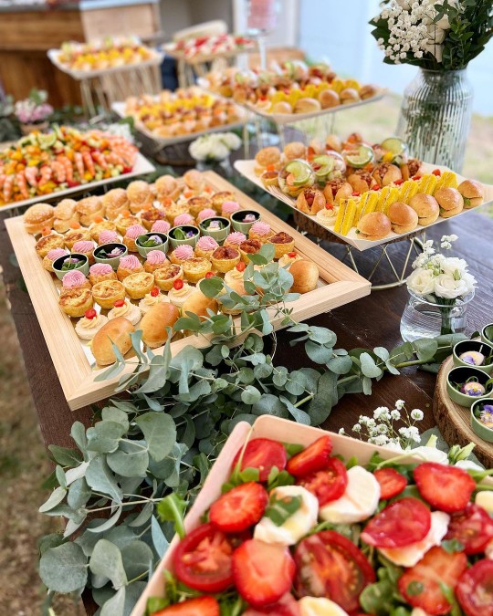 Elegant outdoor cocktail buffet with floral styling